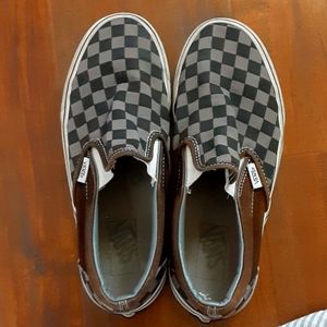 Grey and black checkered Vans